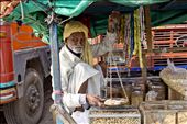 Merchants are seen all over Indian cities and towns. Selling food, sweets and nuts via a cart is common practice and an important part of Indian daily life.  
This old man has been working and making a living with his wagon for over 50 years.: by isabelp, Views[1635]