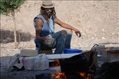The beduin is cooking a snack in the open ski. A little bit of shadow gives him the oportunity to stay near the fire even if outside it's a boilling weather.: by israel, Views[328]