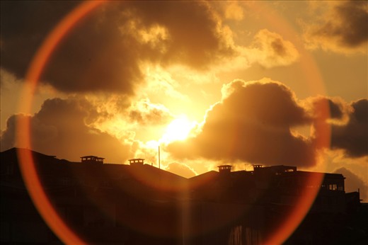 Sunset over the distant slums that trickle out from the city’s heart