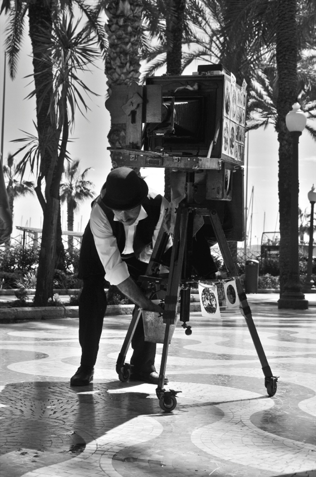 CAPTURING MEMORIES OF LIFE THROUGH OLD TECHNIQUES .... this lovely man was on the sidewalk taking and selling photos of people with this amazing traditional and still working camera 