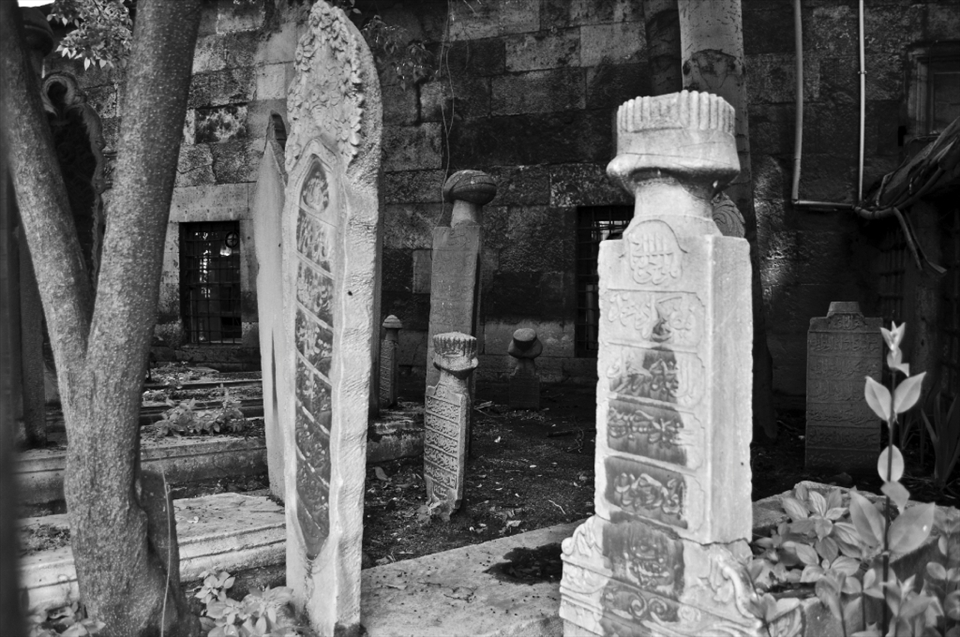 DEATH OF LIFE ... this little burial site was located on the sidewalk behind a fence. It was only a small place but I am guessing this is so they can be closer to the ones they love 