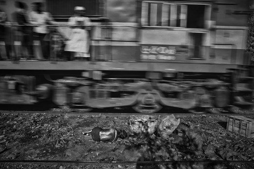 A old lady sleeping beside the rail