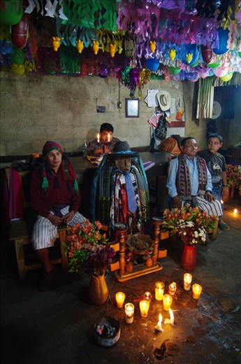 Each year a home hosts an effigy of Maximon a benevolent diety with a penchant for cigars, run and money.