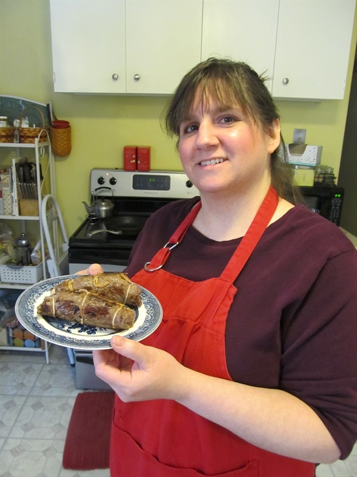 Me holding the browned braciole.