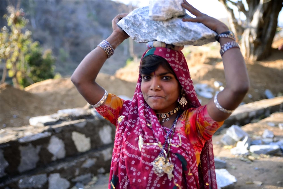 While the men are breaking the boulders, the young girls are used as the main means of transport for carrying these heavy stones around.