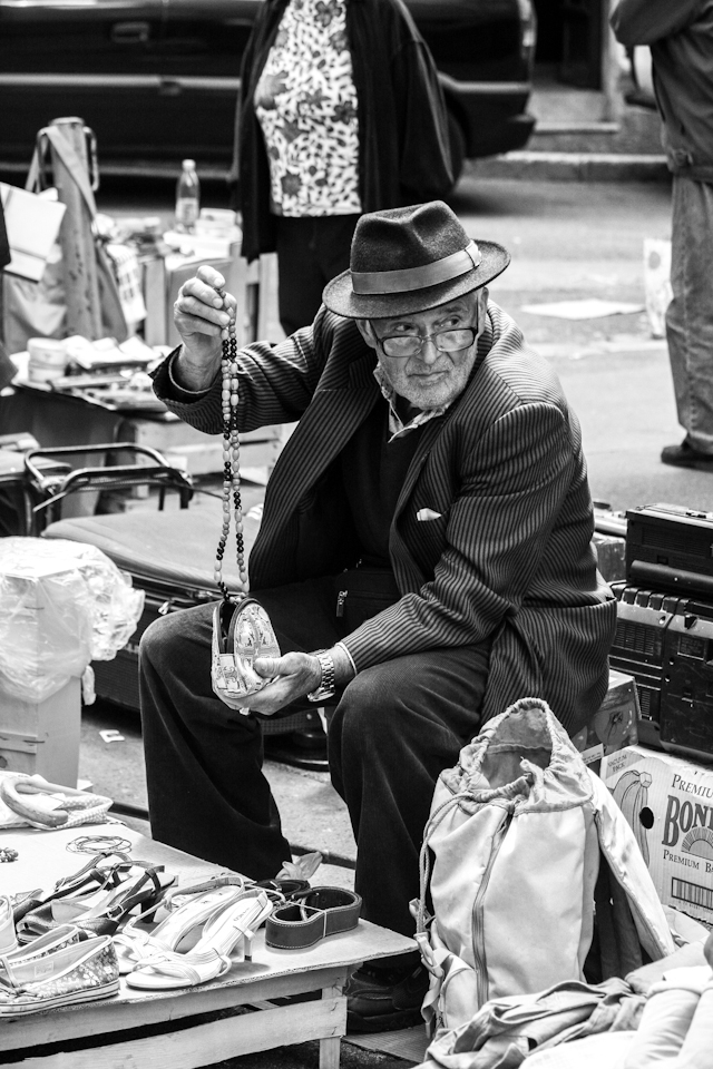 Every day old man comes to street to sell things that he does not need any more