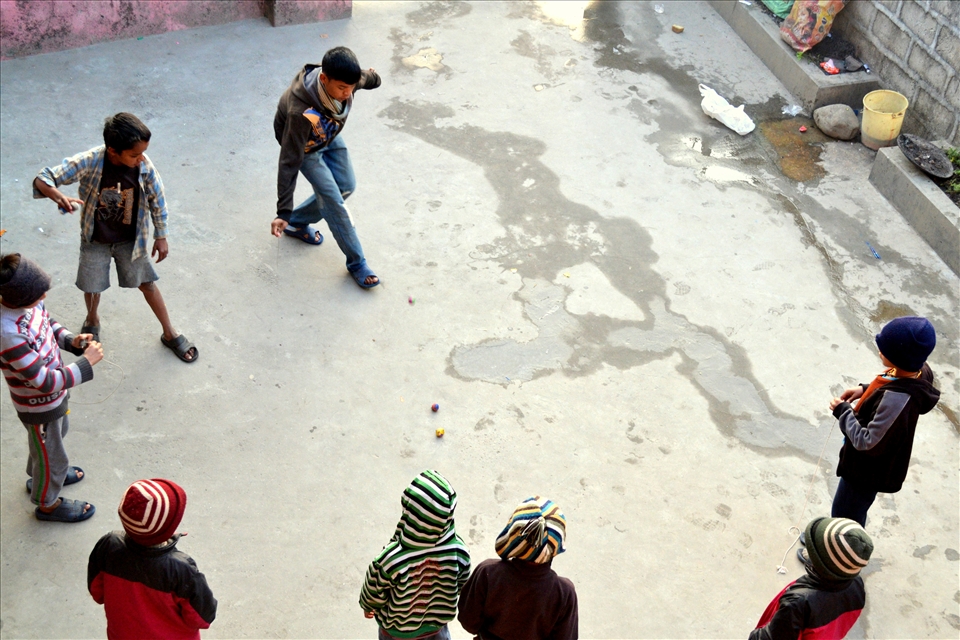As soon as school finished for the day, the boys would be in the courtyard playing with their spinning tops. 