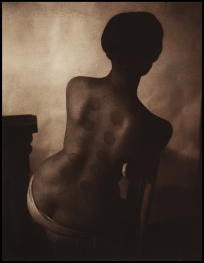 The last photograph is a departing picture. One I took just before I left. Her name is Natalie, and she was a bit of a wonderer, a displaced soul, who I'd eventually come to know quite well. We ended up living together and exchanging and making many experiences. She'd come home one day, with these markings on her back after getting Chinese suction therapy, and I immediately photographed the wonderful impressions. Polaroid 350 -  Chocolate 100