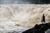 A brave fisherman stares into the wall of water at Khone Phapheng falls before casting his net into the ferocious current. During the rainy season the Mekong river swells rapidly causing millions of litres of water to crash over the falls each second. The highest flow ever recorded at Khone Phapheng falls was 49,000,000 litres a second. A select few fishermen risk their lives daily to carve out a living fishing these waters.: by jacobjamesphoto, Views[1180]