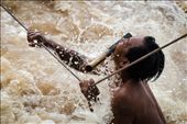 The fisherman holds on for his life knowing that one mistake here would result in certain death. The ranging Mekong pulls at his body as his weary arms cling desperately to hold him on the rope. Times like these rely on full concentration and both hands on the rope at a time, any extra luggage has to go in the mouth, knives included.: by jacobjamesphoto, Views[466]