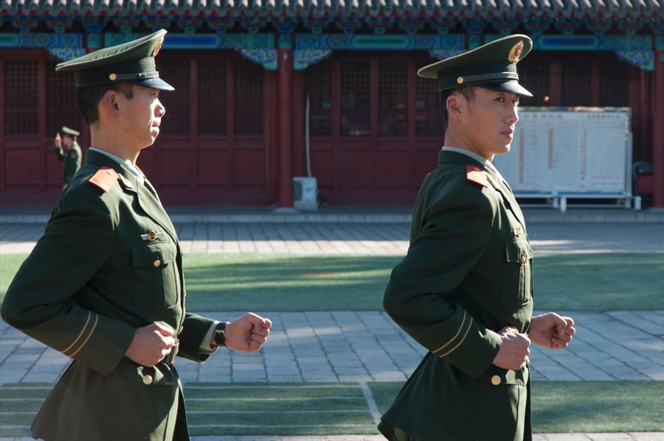Happy members of the People's Armed Police Force exercising near the entrance to the Forbidden City. 