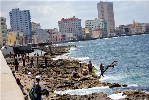 Mid Afternoon on The Malecón – This is the place to be, teenagers can get a reprieve from the stifling afternoon sun and a chance to socialise and laze around on the rocks, meanwhile the more daring youths dive into the Gulf of Mexico waters without any caution for their well-being. Momentarily oblivious to that mighty land merely 100 miles to the north who for the past 50 years has helped prevent any kind of real progress.