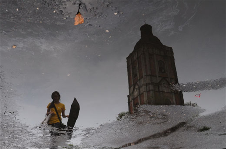 3.	The Belfry and the Girl with a Yellow Shirt. The old belfry of the Cathedral of the Roman Catholic Church in Jaro in Iloilo City is one of the most famous landmarks in Iloilo. Though several earthquakes have damaged the belfry it was repaired by devotees of the church, proving that trough a united faith as Christians, problems can be resolved. This picture was taken after a heavy afternoon rain.