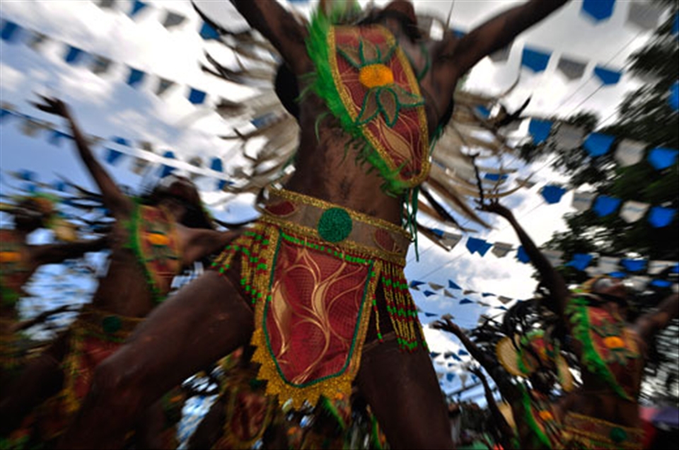 5.	Dinagyang Festival. One of the most important festivals in the Philippines is Dinagyang Festival. It is held to honor the Sto. Niño and to re-inact the selling of the island of Panay to the Malays by the Atis. The festival uses percussions and people dances wildly into the beats. The picture shows a group of performance in an ecstatic revelry. Dinagyang is a festival that unites every Ilonggo and that help the festival to be elevated in the Hall of Fame by the Association of Tourism Ofiicials in the Philippines as the best tourism event in the country. It is held every fourth Sunday of January.