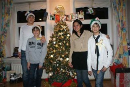 Had our picture taken by the Christmas tree. With me are my cousins, Ralph, Gaby and Miki.