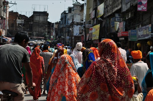In the busy streets of India women cover their heads in colourful dupattas.