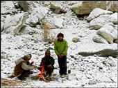 Fire for survival. Little firewood. Flint stones for ignition. Back to Stone Age.

1PM in the afternoon. As temperatures hover around -15 degrees centigrade, these fires become a necessity whenever you are resting. The only problem is a lack of firewood in arid, cold and barren Ladakh. The shrub seen behind cannot be used, it is prohibited since it is one of the few Oxygen providers in the surrounding. Stanzin and Tsering, seen facing the photographer, were adept at finding us firewood and much needed heat. The technique of using flint stones to ignite fire took us back to the Stone Age.: by jajaborthenomad, Views[297]