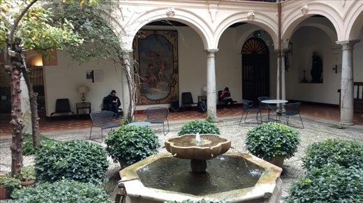 Beth and Maya reading in the patio in the Parador in the Alhanbra