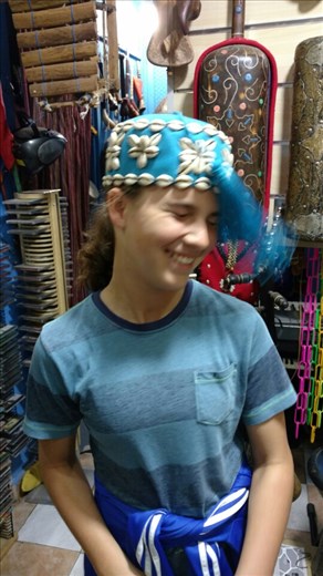 Maya trying, and failing, to spin the tassle on her fez