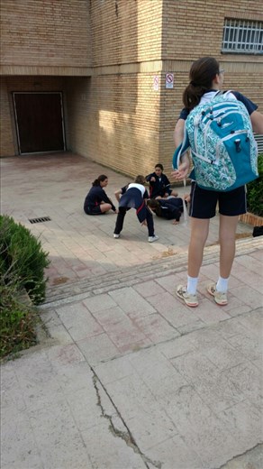 Maya doing push-ups before school