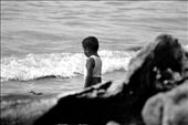 This little boy observes the waves as it slap on the shore. Building up courage for a dip by himself. : by jalokivi, Views[455]