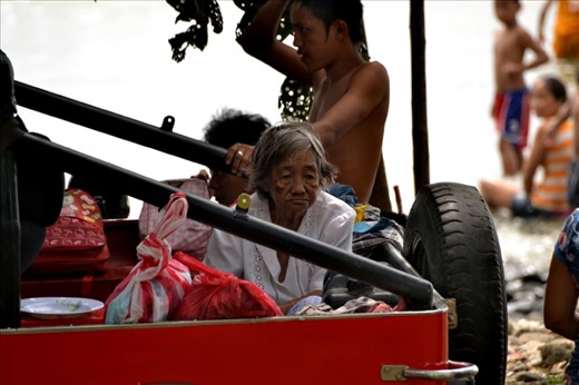 No one is left behind at home. This old woman unable to move around much joined in the for the celebration even if all she have to do is sit there watching what is happening.