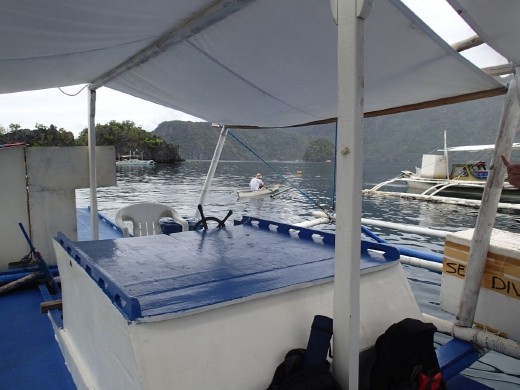 The guy in the background is the reef keeper, as soon as you park up he paddles over to collect fees. Great income for the local people, Coron, Palawan
