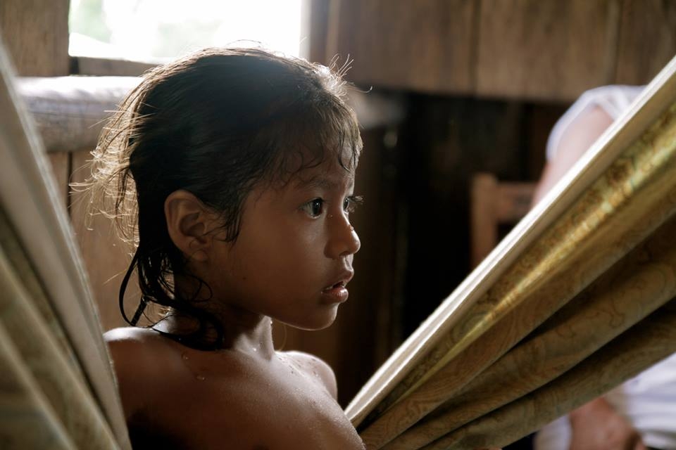 A young girl who led some friends and I to her parents house to buy coconuts.