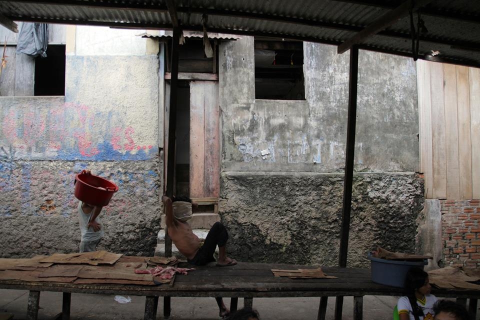 Walking through the Belen market to get to my hostel, a man rests at his stall. 