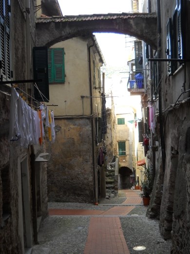 Walking through the narrow lanes of the Old Town in Ventimiglia, Italy. Like many of the hill towns, residents still live in the centuries old homes.