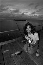 A friend with her first catch, two large squid caught with lures.  The night was cold, wet and dark but the successful catch made it worthwhile: by james_trezise, Views[409]