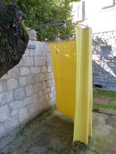 Cold shower at the campground, garden style