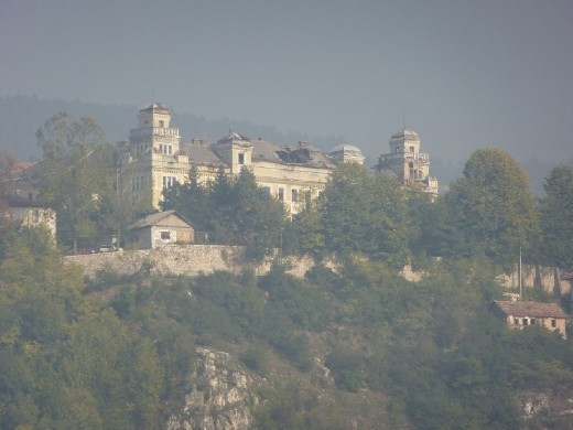 Massive hole in abandoned palace roof from the war.