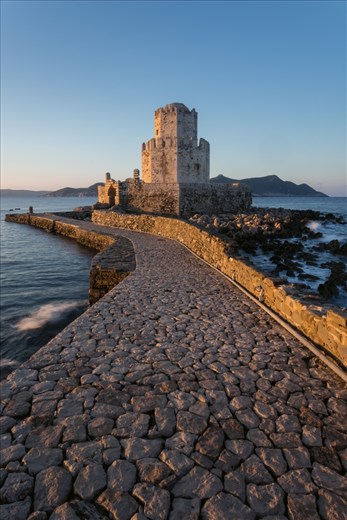 This is the bourtzi at the end of the castle in Methoni. It had been used as many things including a prison at one point.

The castle is never usually open within the golden hours, but a fortunate passing at sunrise saw the gates open allowing me to capture this image,