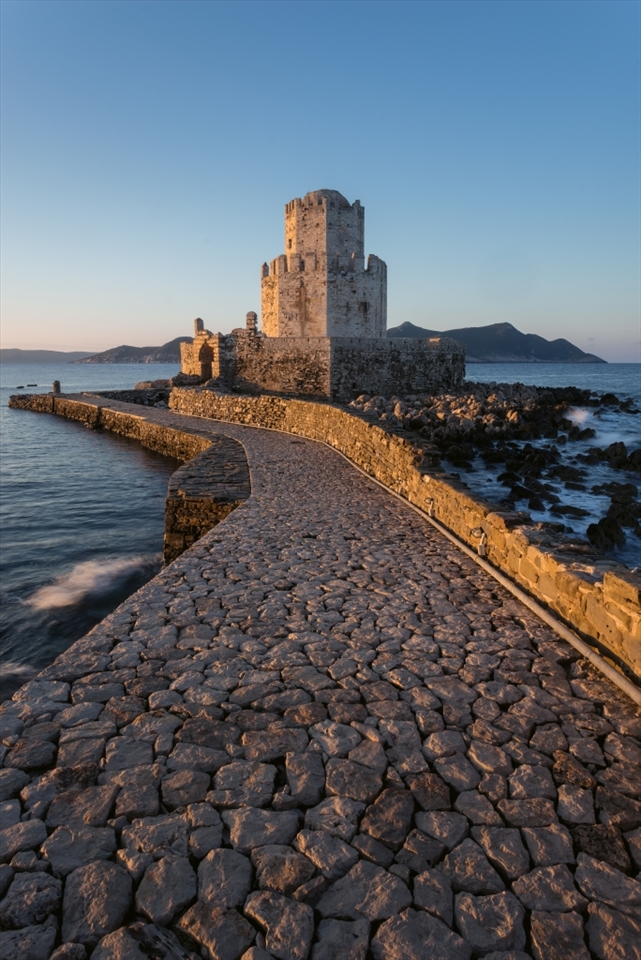 This is the bourtzi at the end of the castle in Methoni. It had been used as many things including a prison at one point.

The castle is never usually open within the golden hours, but a fortunate passing at sunrise saw the gates open allowing me to capture this image,