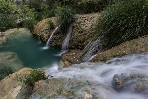 Polylimnio Waterfalls are in a deep cool gorge in Southern Greece. Its more like an Amazonian world in there with fresh waters channelling down.

I had been visiting the area for years but never knew about the area before and was taken back in amazement, especially as the surrounding areas are baron fields and olive trees.