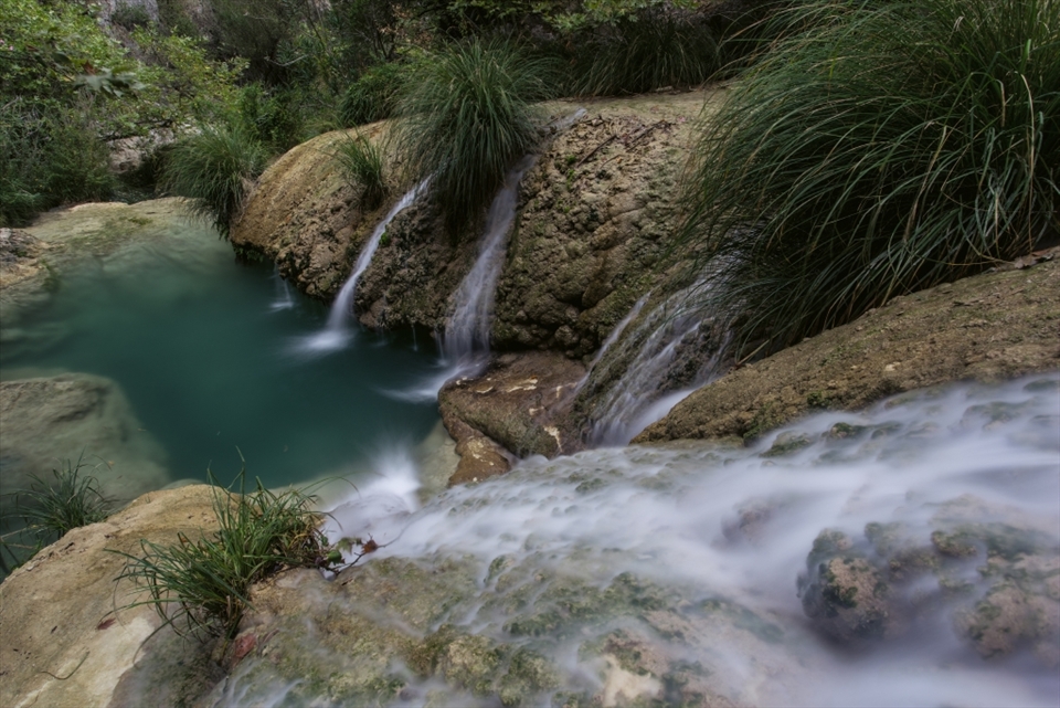 Polylimnio Waterfalls are in a deep cool gorge in Southern Greece. Its more like an Amazonian world in there with fresh waters channelling down.

I had been visiting the area for years but never knew about the area before and was taken back in amazement, especially as the surrounding areas are baron fields and olive trees.