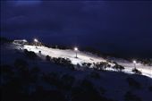 A lone 'Snow Cat' grooms the slopes after lifts have closed at Front Valley of Perisher Ski Resort, Kosciuszko National Park, AUSTRALIA. 2013 has seen a slow start to the snow season, relying heavily on man made snow and cloud seeding to boost snow depth for consumers.: by jamespresneill, Views[744]