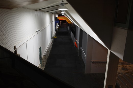 Architectural lines frame the main building of Perisher Resort's Front Valley after closing time. This section of walkway is the main throughfare from the car park to ski hire, lift ticket sales and the beginner ski lifts. During the day, hundreds of snowboards and skis will line the racks along either side of this corridor of high activity.