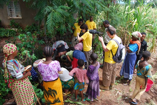 Charity work filming in a village