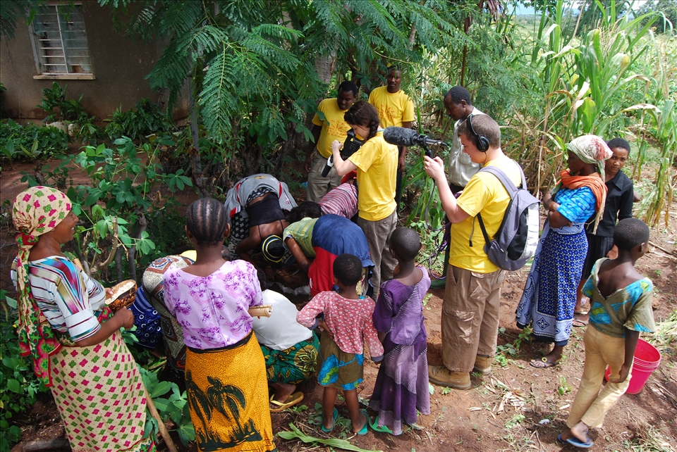 Charity work filming in a village