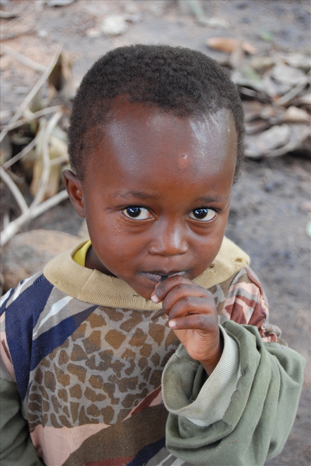 A nervous child in an African village