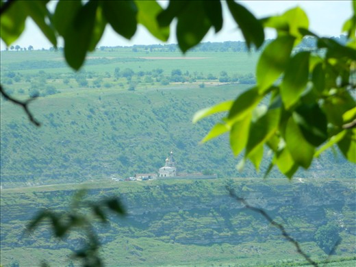 Sitting in the shadow of a nut tree, above the caves, we see the fused church.