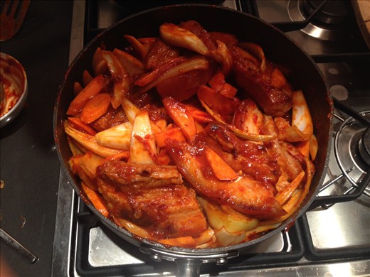 Add carrots and onions to pork mix and stir through