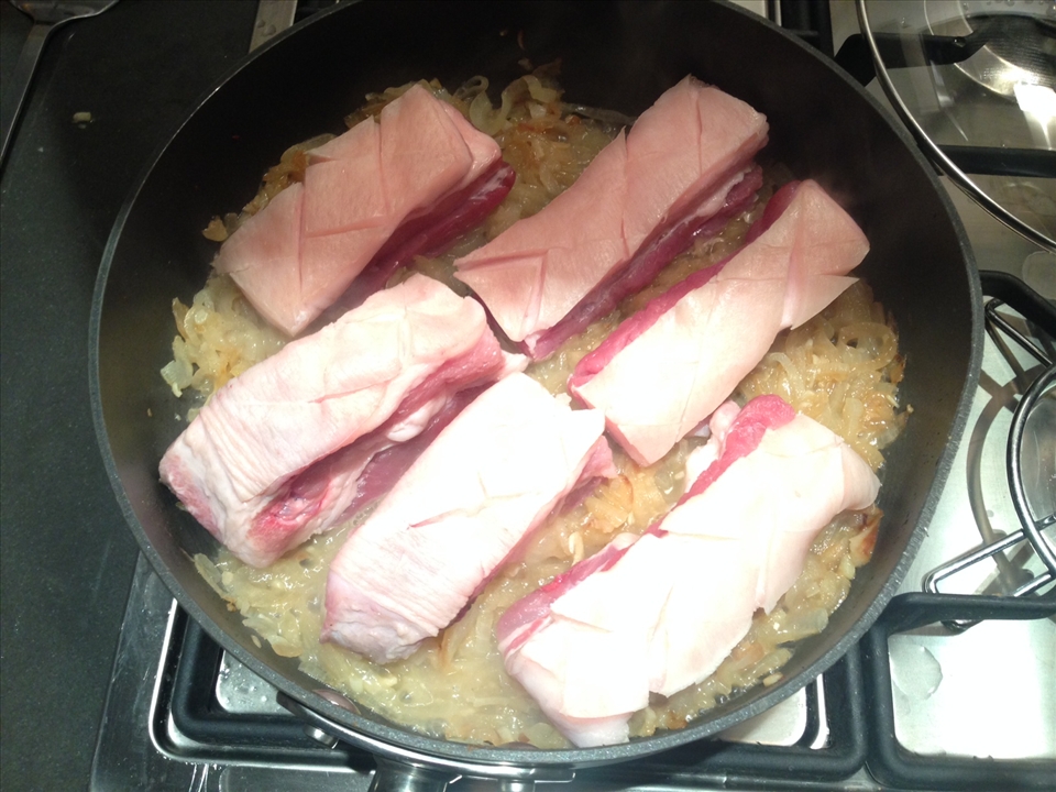 Add pork to sweated onions with the chili paste and mix