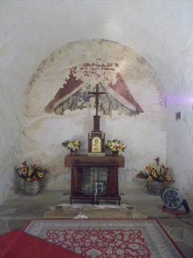 A side room that shows some of the original paint on the walls