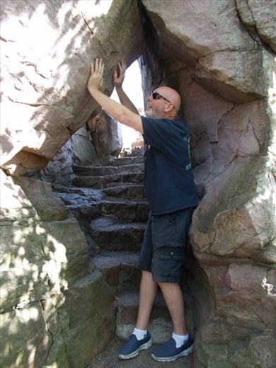 Joe bravely holding up the rocks to the top of Winniwissa Falls