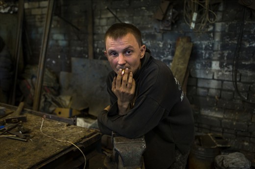 Boris waits for his iron rods to heat to a malleable temperature.