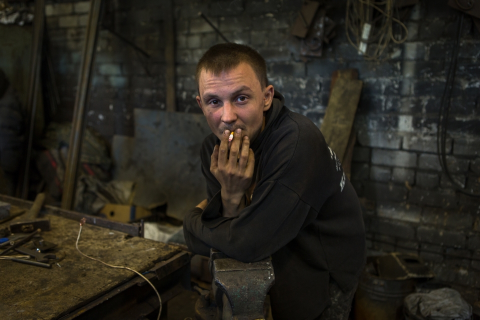 Boris waits for his iron rods to heat to a malleable temperature.