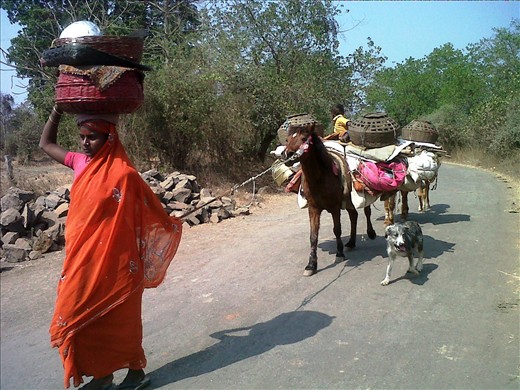 A nomadic family traveling with their entire household in search of work.